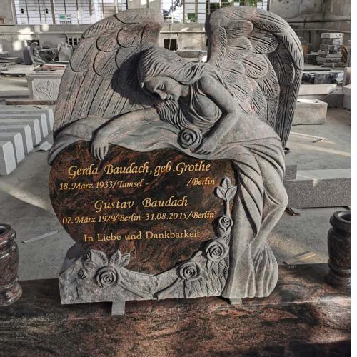 granite headstone monument with angel engraving